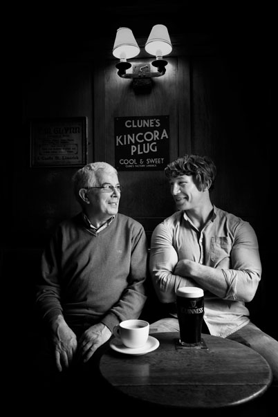 Munster and Ireland's rugby star Jerry Flannery with his dad at Flannery's pub Limerick Ireland.  